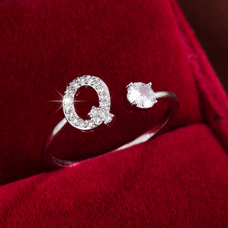 Adjustable Copper Ring With Four-claw Round Zirconia, Featuring The 26 English Letters Of Fashion Trend.