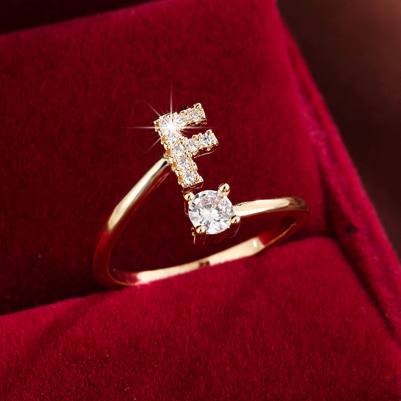 Adjustable Copper Ring With Four-claw Round Zirconia, Featuring The 26 English Letters Of Fashion Trend.