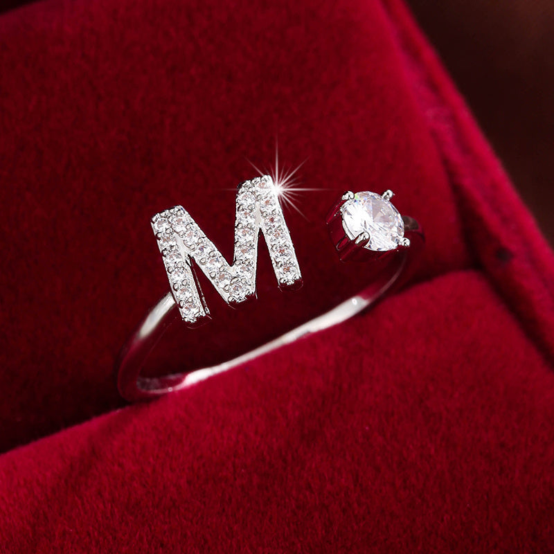 Adjustable Copper Ring With Four-claw Round Zirconia, Featuring The 26 English Letters Of Fashion Trend.