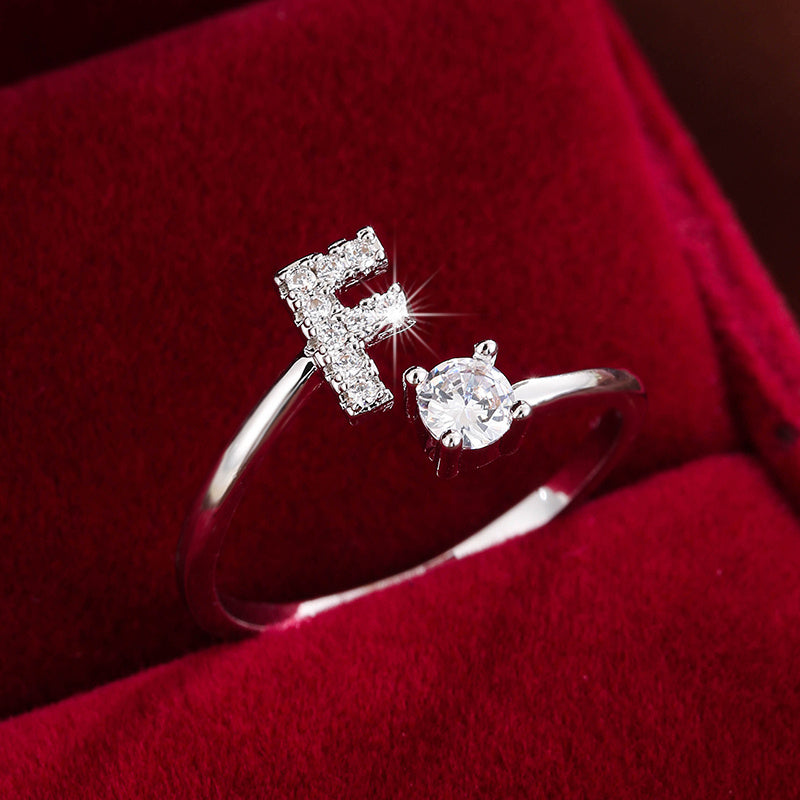 Adjustable Copper Ring With Four-claw Round Zirconia, Featuring The 26 English Letters Of Fashion Trend.