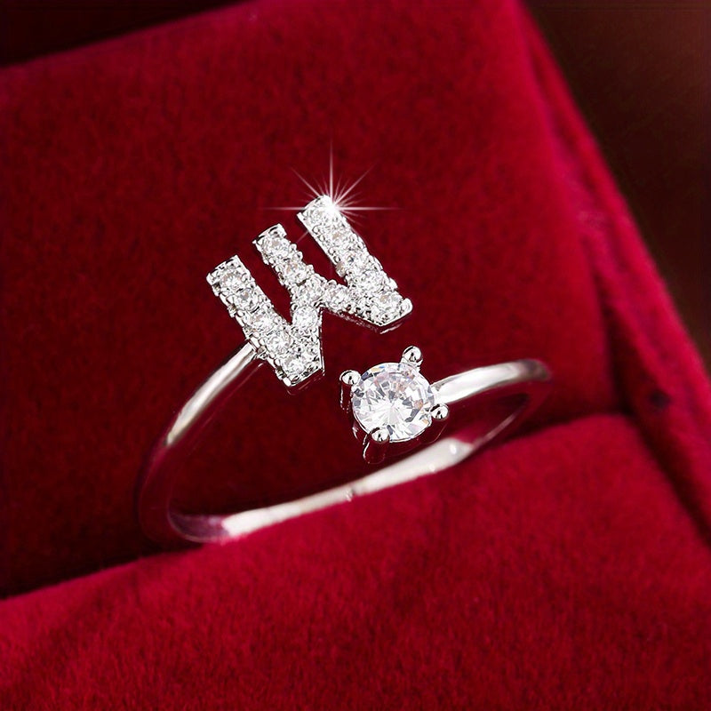 Adjustable Copper Ring With Four-claw Round Zirconia, Featuring The 26 English Letters Of Fashion Trend.