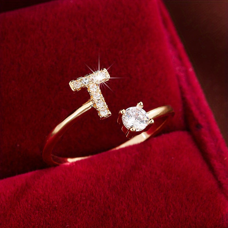 Adjustable Copper Ring With Four-claw Round Zirconia, Featuring The 26 English Letters Of Fashion Trend.