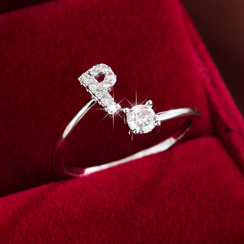 Adjustable Copper Ring With Four-claw Round Zirconia, Featuring The 26 English Letters Of Fashion Trend.