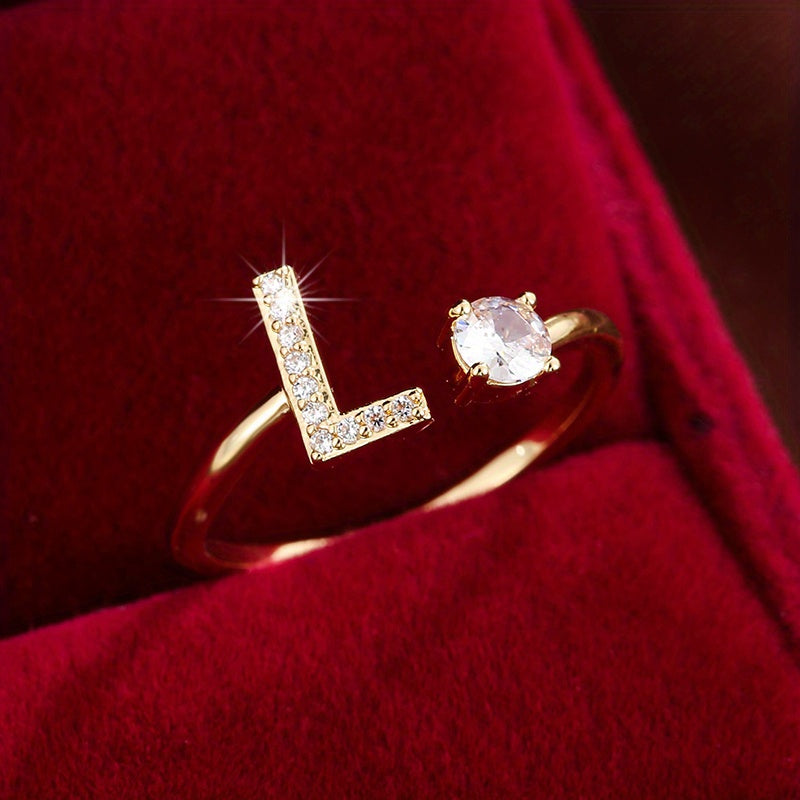 Adjustable Copper Ring With Four-claw Round Zirconia, Featuring The 26 English Letters Of Fashion Trend.