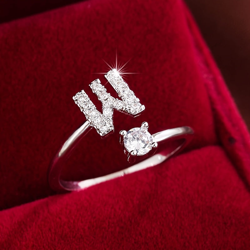 Adjustable Copper Ring With Four-claw Round Zirconia, Featuring The 26 English Letters Of Fashion Trend.