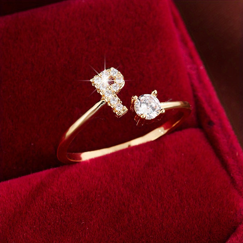 Adjustable Copper Ring With Four-claw Round Zirconia, Featuring The 26 English Letters Of Fashion Trend.