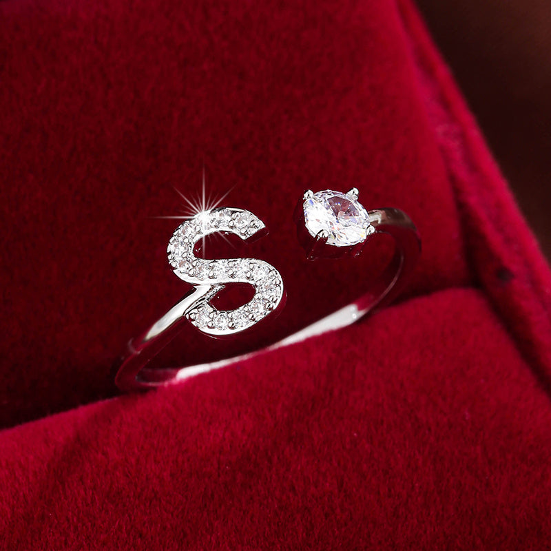 Adjustable Copper Ring With Four-claw Round Zirconia, Featuring The 26 English Letters Of Fashion Trend.