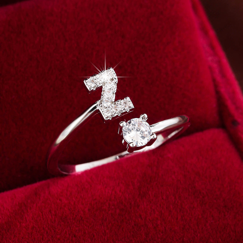 Adjustable Copper Ring With Four-claw Round Zirconia, Featuring The 26 English Letters Of Fashion Trend.