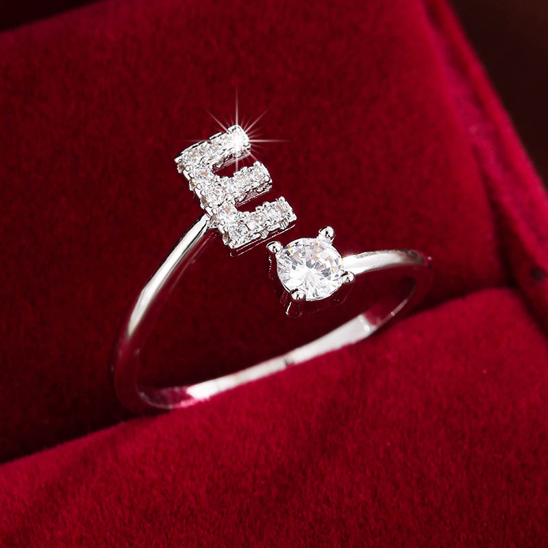 Adjustable Copper Ring With Four-claw Round Zirconia, Featuring The 26 English Letters Of Fashion Trend.
