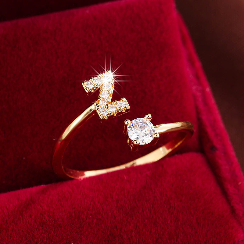 Adjustable Copper Ring With Four-claw Round Zirconia, Featuring The 26 English Letters Of Fashion Trend.